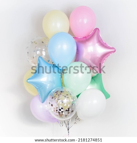 Set of multicolour foil helium balloons in form of stars. Concept of holiday, happy birthday. Royalty-Free Stock Photo #2181274851