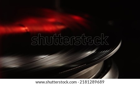 Retro-styled spinning record vinyl player. Close up. Rotating vintage phonograph close up. Beautiful colorful picture. Copy space,
