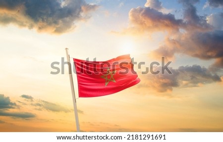 Morocco national flag waving in beautiful clouds. Royalty-Free Stock Photo #2181291691