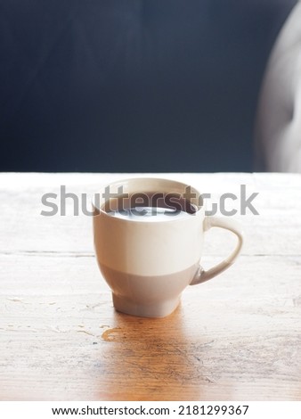 One a cup tea warm satu cangkir teh hangat disajikan di atas meja kayu