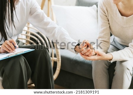 psychological consultation young Asian specialist psychologist or coach conducts a session for a patient of a young woman, problem solving, mental health Royalty-Free Stock Photo #2181309191