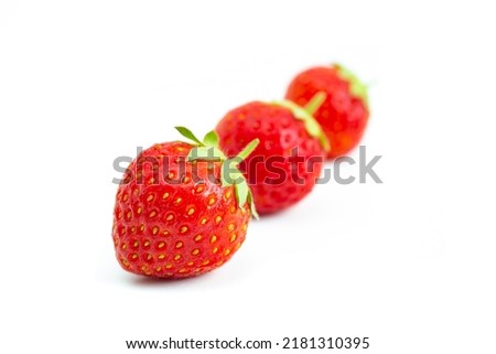 Strawberries isolated on white background. Still-life picture taken in studio with soft-box.