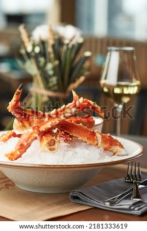 king crab with white wine Royalty-Free Stock Photo #2181333619