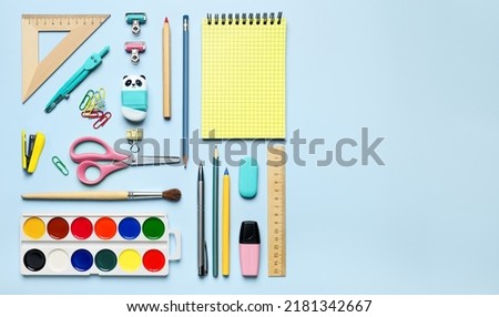 Colorful stationary school supplies on blue background, space for text flat lay. Back to school template