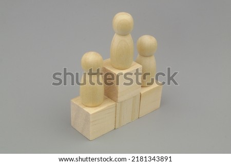 People figures on wooden steps  on gray background. Ranking people concept.