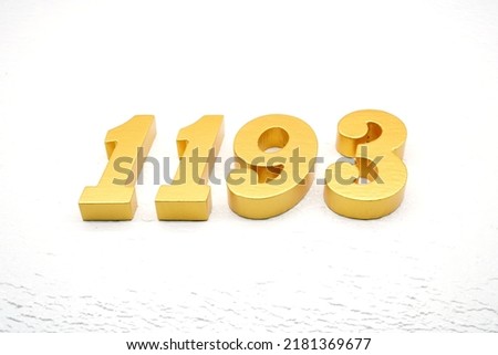     Number 1193 is made of gold painted teak, 1 cm thick, laid on a white painted aerated brick floor, visualized in 3D.                                