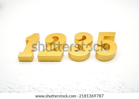   Number 1235 is made of gold painted teak, 1 cm thick, laid on a white painted aerated brick floor, visualized in 3D.                                