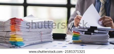 business documents businessman check legal document review Prepare documents or analysis reports, tax items, accounting documents, data contracts, office partner agreements.