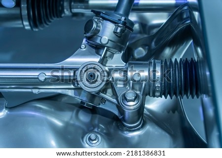 electric system of eco car front driving axle in the car, visible elements of the steering system Royalty-Free Stock Photo #2181386831