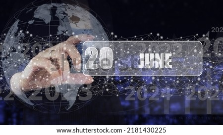 June 20th. Day 20 of month, Calendar date. Hand hold virtual screen card with calendar date.  Summer month, day of the year concept