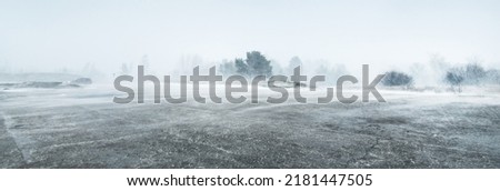Baltic sea coast after storm and blizzard. Liepaja, Latvia. Epic spring landscape. Cyclone, gale, rough weather, meteorology, climate change, natural phenomenon Royalty-Free Stock Photo #2181447505