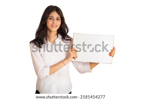 A young girl or businesswoman holding a signboard in her hands on a white background.
