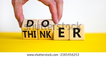 Doer or thinker symbol. Concept words Doer or thinker on wooden cubes. Businessman hand. Beautiful yellow table white background. Business and doer or thinker concept. Copy space. Royalty-Free Stock Photo #2181456253