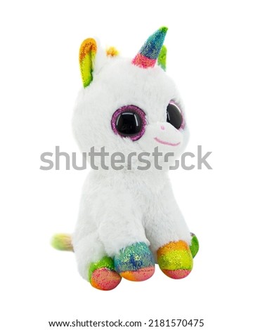 White plush unicorn toy isolated on the white background