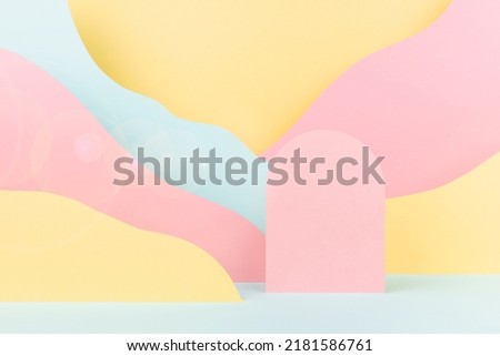 Arch pink podium mockup, abstract mountain landscape - pastel pink, yellow, mint color slopes, sunbeam glare in baby cartoon naive style. Template for presentation cosmetic, advertising, showing.