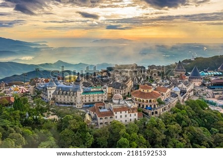 Aerial view of landscape is castles covered with fog at the top of Bana Hills, the famous tourist destination of Da Nang, Vietnam. Near Golden bridge. Panorama French village