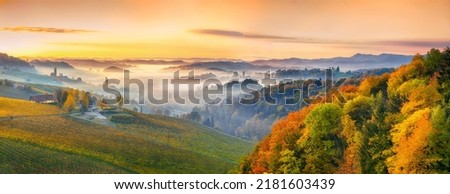 Splendid vineyards landscape in South Styria near Gamlitz. Autumn scene of grape hills in popular travell destination Eckberg. Location: Gamlitz, district of Leibnitz in Styria, Austria. Europe. Royalty-Free Stock Photo #2181603439
