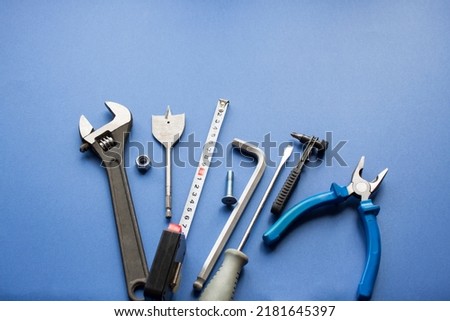 Set of construction tools with tape measure on sienm background