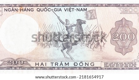 Warrior on horseback leading soldiers. Portrait from South Vietnam 200 Dong 1966 Banknotes.  Royalty-Free Stock Photo #2181654917