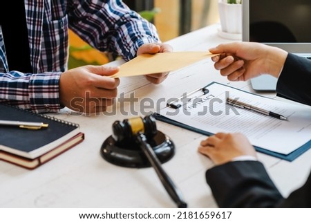 Businessmen or politicians agree to accept bribes given in envelopes. To do illegal business, corruption in the contracting business, corruption concept and bribery.