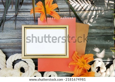 Empty frame mock up with lily flowers, outdoor photo with palm shadows