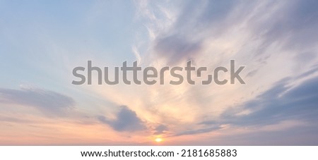 Clear blue sky. glowing pink and golden cirrus and cumulus clouds after storm, soft sunlight. Dramatic sunset cloudscape. Meteorology, heaven, peace, graphic resources, picturesque panoramic scenery Royalty-Free Stock Photo #2181685883