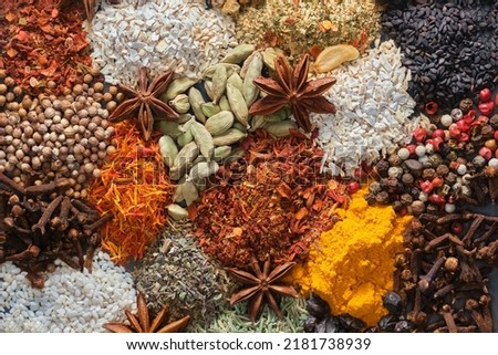 Spices. Aromatic Indian spices on a slate background. Spices and herbs on a stone background. Assortment of Seasonings, condiments, Dry colorful condiments. Culinary, cooking ingredients Royalty-Free Stock Photo #2181738939