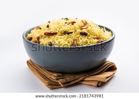 Kashmiri sweet modur pulao made of rice cooked with sugar, water flavored with Saffron and dry fruits Royalty-Free Stock Photo #2181743981