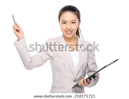Businesswoman with clipboard and pen up