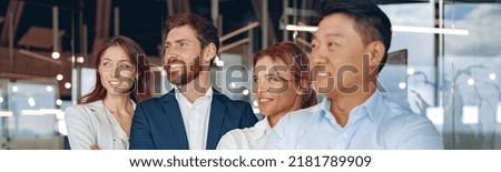 Portrait of business people standing with arms crossed in modern office. High quality photo