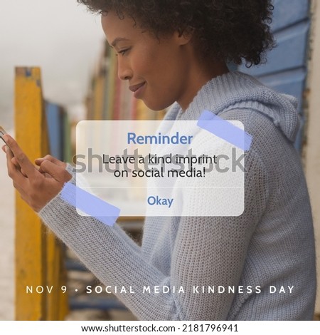 Digital composite image of african american young woman using smart phone with reminder message. Raise awareness, being kind online, celebration, technology, social media kindness day.