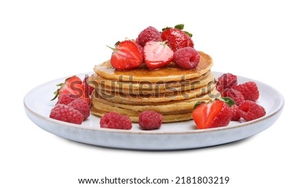 Tasty pancakes with fresh berries and honey on white background Royalty-Free Stock Photo #2181803219