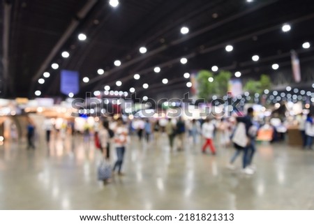 Abstract blur people in exhibition hall event trade show expo background. Large international exhibition, convention center, business marketing and event fair organizer concept. Royalty-Free Stock Photo #2181821313