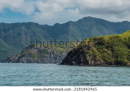 the green and rocky coast of the Murcielago Island in Costa Rica Royalty-Free Stock Photo #2181842965