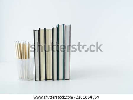 Book or textbook stack with pencil with copy space. Businessperson working or student reading and writingI. Idea of success in business learning course or education studying.