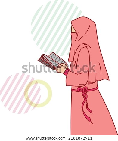 Muslim woman holding a book looks very elegant and charming