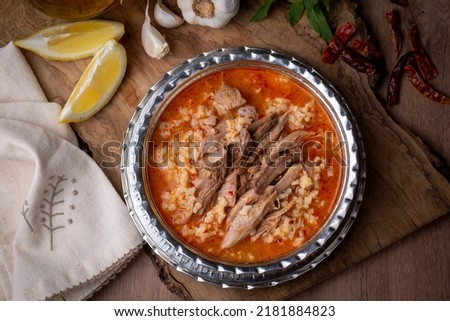 Turkish Soup Beyran with Lamb Meat, Rice, Chopped Garlic and Vinegar Sauce. Traditional Organic Food. Traditional soup of Gaziantep, Turkey. (Turkish name; Beyran corbasi) Royalty-Free Stock Photo #2181884823