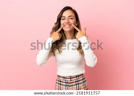 Young woman over isolated background smiling with a happy and pleasant expression