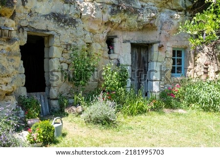 Troglodyte caves in the Loire Valley, France. Houses have been built into the sandstone cliffs of the Loire Valley. Royalty-Free Stock Photo #2181995703
