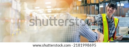 A man and women in charge of large warehouse checking the number items in warehouse that he is responsible for. checking goods in warehouse by scanning a barcode web banner with copy space on left