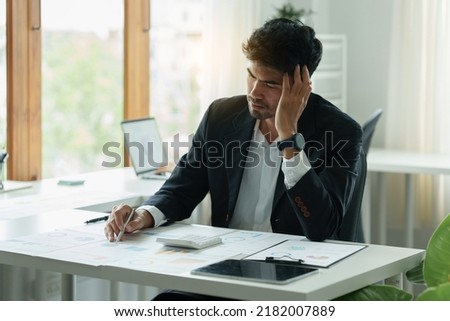 Portrait of Frustrated Business man have problem while sitting at her working place. Business Stressed concept.