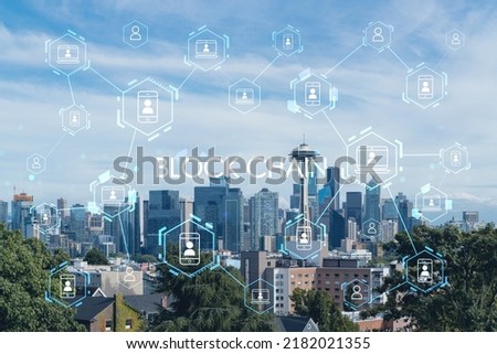 Seattle skyline panorama from Kerry Park. Skyscrapers of financial downtown at day time, Washington, USA. Decentralized economy. Blockchain, cryptography and cryptocurrency concept, hologram