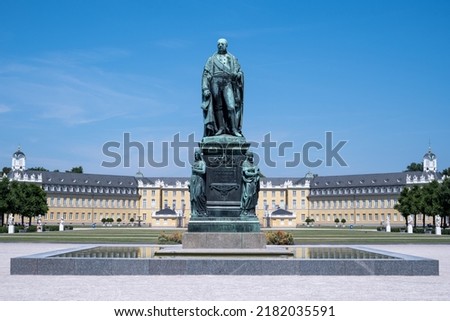 Monument of Karl Friedrich on the background of the Karlsruhe Palace in Karlsruhe, Baden-Wuerttemberg Germany, front view Royalty-Free Stock Photo #2182035591