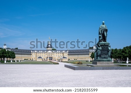 Monument of Karl Friedrich on the background of the Karlsruhe Palace in Karlsruhe, Baden-Wuerttemberg Germany, side view Royalty-Free Stock Photo #2182035599