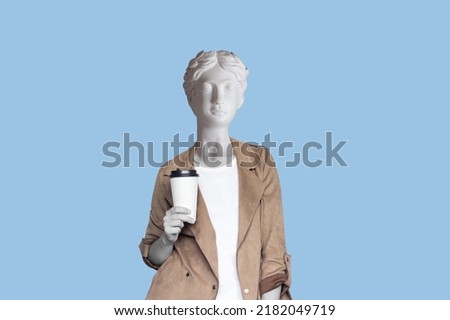 Young successful business woman headed by antique statue holds a white paper cup pf tea or coffee isolated on color blue background. 3d trendy collage in magazine style.Contemporary art. Modern design