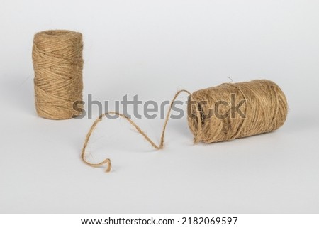 Two skeins with coarse thread on a light background. Accessories for linking objects.