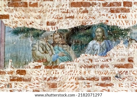 pictures on the wall of an abandoned temple, the temple of the village of Stolpino, Kostroma region, Russia, built in 1758, currently the temple is abandoned
