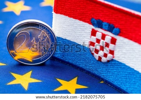 The flag of Croatia against the background of the single currency of the European Union, The concept of Croatia joining the Euro zone,

economic and political background Royalty-Free Stock Photo #2182075705