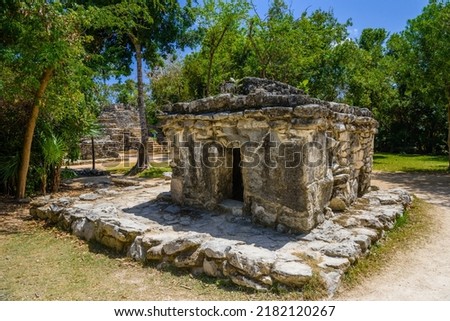 Mayan ruins in shadow of trees in jungle tropical forest Playa del Carmen, Riviera Maya, Yu atan, Mexico. Royalty-Free Stock Photo #2182120267