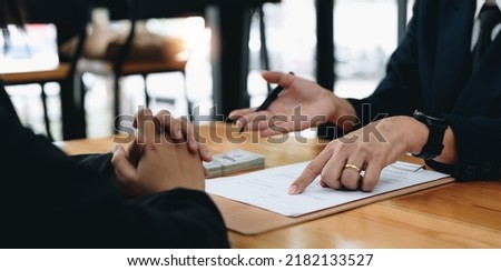 people sign contract to borrow money from investor to invest at own business. loan mortgage finance concept. Royalty-Free Stock Photo #2182133527